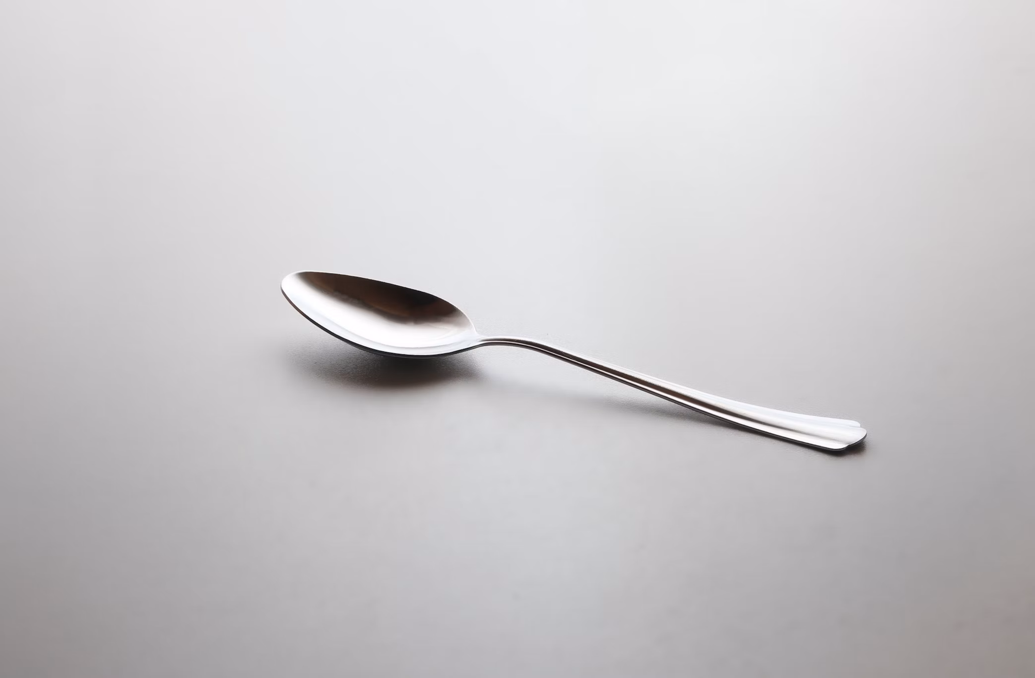 Silver spoon on a white background